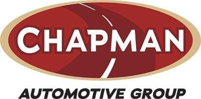 Logo for Chapman Automotive Group featuring the word "CHAPMAN" in white letters on a red oval background with a stylized road design, and "AUTOMOTIVE GROUP" below in black text.